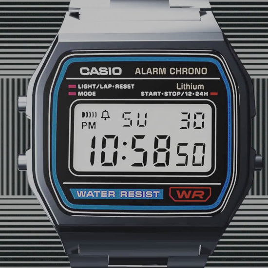 Casio Vintage A158WA-1 digital watch with silver-tone stainless steel band, chrome-plated resin case, green LED backlight, stopwatch, daily alarm, auto-calendar, water resistance, slim 8.2 mm profile, lightweight 46 g build, and 7-year battery life.”