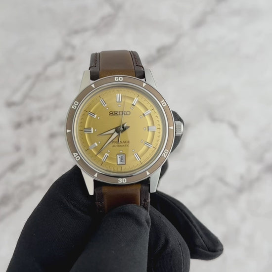 Seiko Presage SRPL75 Style60’s – golden dial automatic watch inspired by 1960s design, with box Hardlex crystal, see‑through caseback, brown leather strap, and 41‑hour power reserve.”