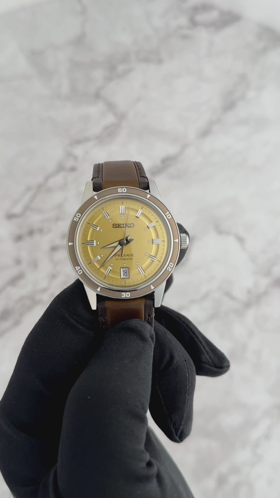 Seiko Presage SRPL75 Style60’s – golden dial automatic watch inspired by 1960s design, with box Hardlex crystal, see‑through caseback, brown leather strap, and 41‑hour power reserve.”