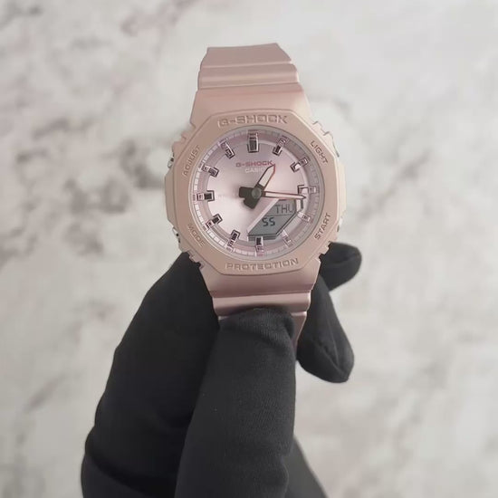 Casio G-SHOCK GMAP2100ST-4A – slim metallic-pink bio-based resin watch with pearlescent polarized finish, octagonal bezel, analog-digital display, and 200m water resistance.