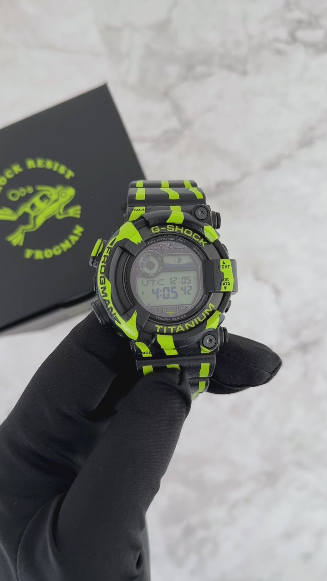 G-SHOCK FROGMAN GW8200TPF-1 professional dive watch with a black and fluorescent green design inspired by a poison dart frog, titanium case, ISO 200m water resistance, and Tough Solar power.