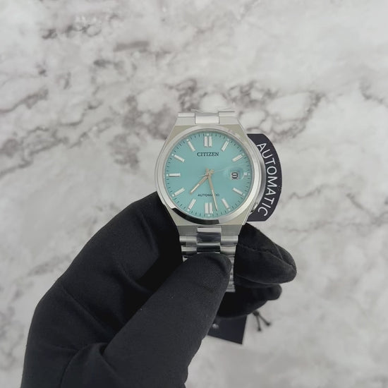 Citizen Tsuyosa Automatic NJ015 series watch with a sunray sky blue dial, integrated stainless steel bracelet, sapphire crystal, and automatic mechanical movement for everyday sporty wear.