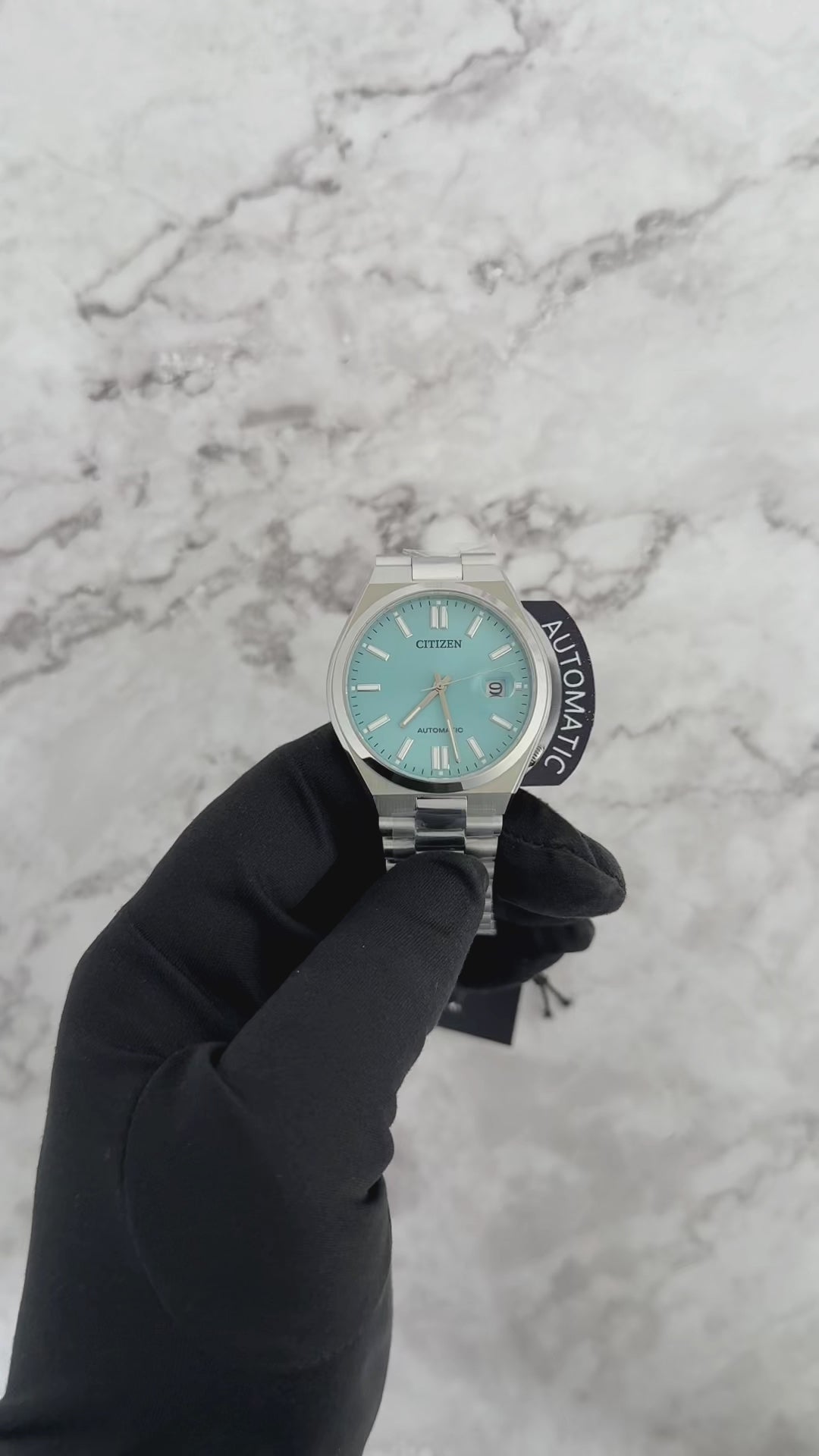 Citizen Tsuyosa Automatic NJ015 series watch with a sunray sky blue dial, integrated stainless steel bracelet, sapphire crystal, and automatic mechanical movement for everyday sporty wear.