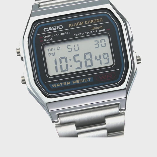 Casio Vintage A158WA-1 digital watch with silver-tone stainless steel band, chrome-plated resin case, green LED backlight, stopwatch, daily alarm, auto-calendar, water resistance, slim 8.2 mm profile, lightweight 46 g build, and 7-year battery life.”