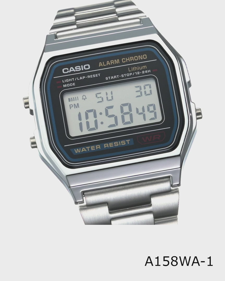 Casio Vintage A158WA-1 digital watch with silver-tone stainless steel band, chrome-plated resin case, green LED backlight, stopwatch, daily alarm, auto-calendar, water resistance, slim 8.2 mm profile, lightweight 46 g build, and 7-year battery life.”