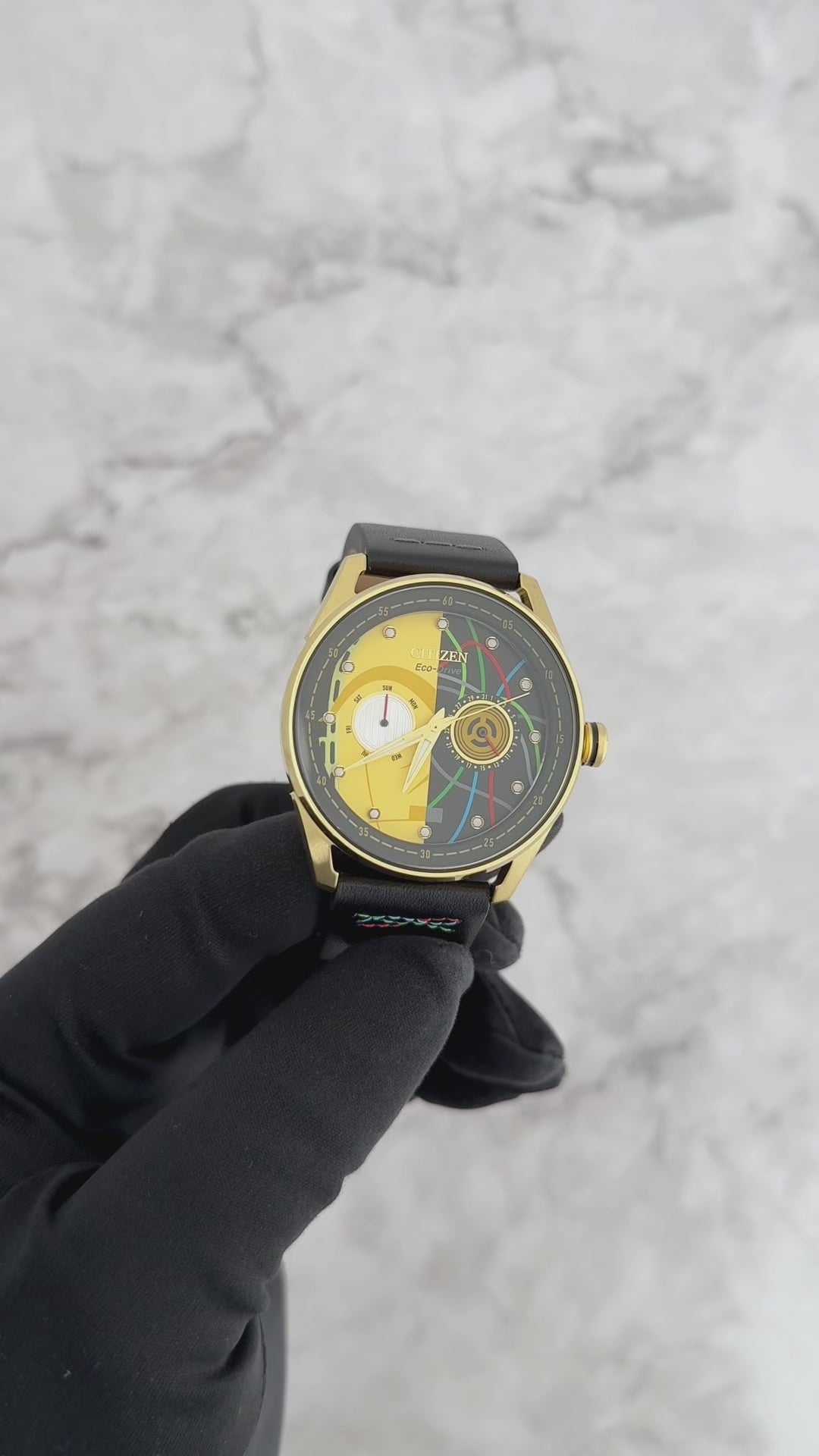 CITIZEN Star Wars C-3PO Rewired BU4026-05W – gold-tone Eco-Drive watch with yellow dial, C-3PO-inspired details, black leather strap with colorful stitching, and WR100 water resistance.