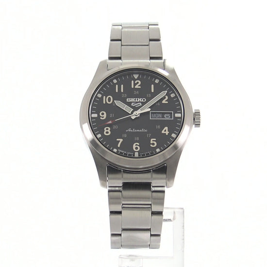 Seiko 5 Sports SRPG27 automatic watch with a black field-style dial, Arabic numerals, red-tipped second hand, stainless steel case and bracelet, and military-inspired design