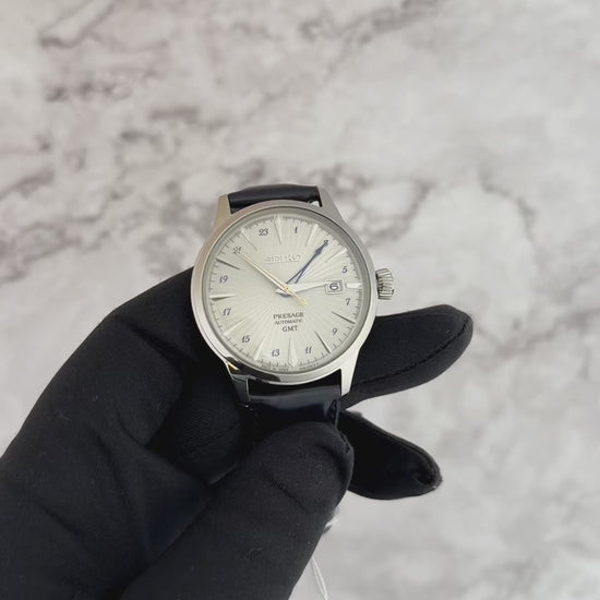 Seiko Presage Cocktail Time GMT SSK049 automatic watch with vintage-tone silver dial, blue cocktail-glass–shaped GMT hand, blue 24-hour scale, and dark blue leather strap, U.S. Special Creation.