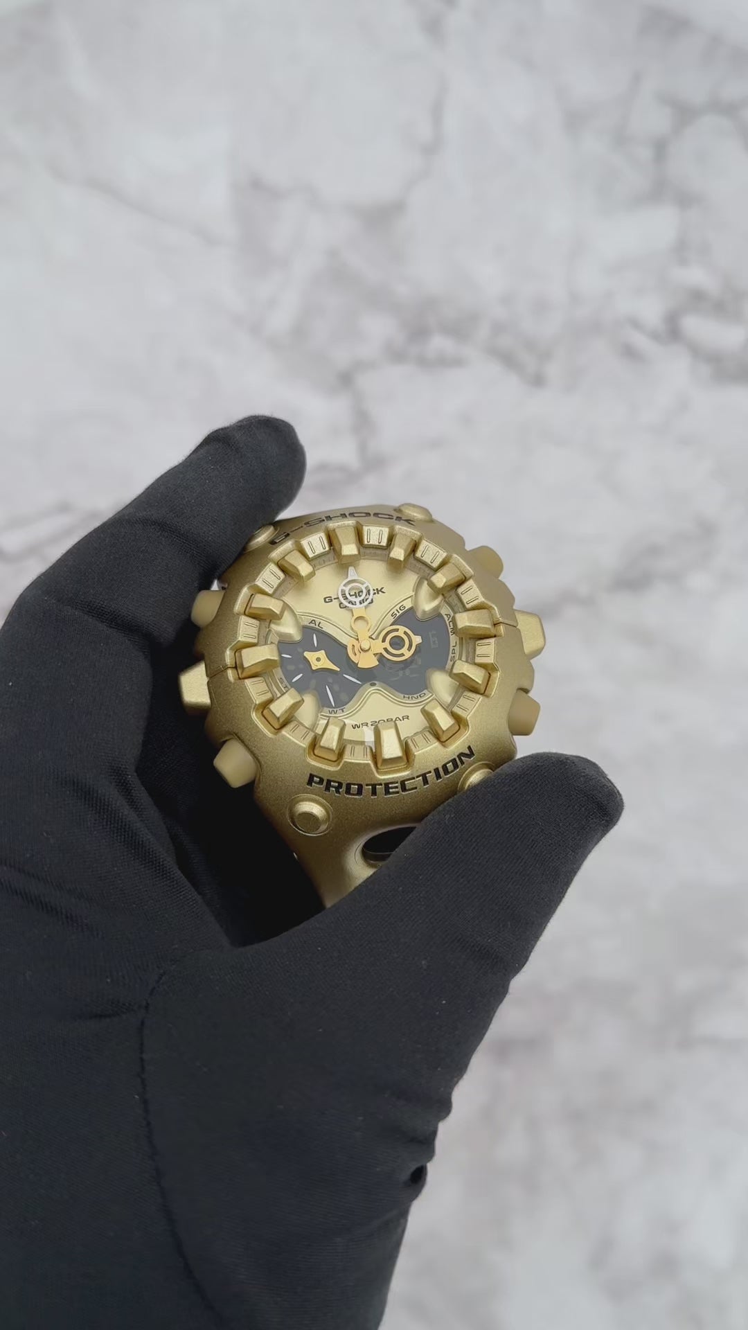 G-SHOCK GAV01A-9A gold-tone resin watch featuring sculpted futuristic case design, layered analog-digital open-work dial, full-screen LCD, magnetic Shock Release Hand structure, double LED Super Illuminator, and 200-meter water resistance.