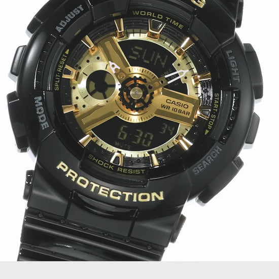 Casio BABY-G BA110-1A analog-digital watch with a bold black and gold colorway, GA110-inspired mechanical dial, layered 3D design, and shock-resistant Baby-G construction.