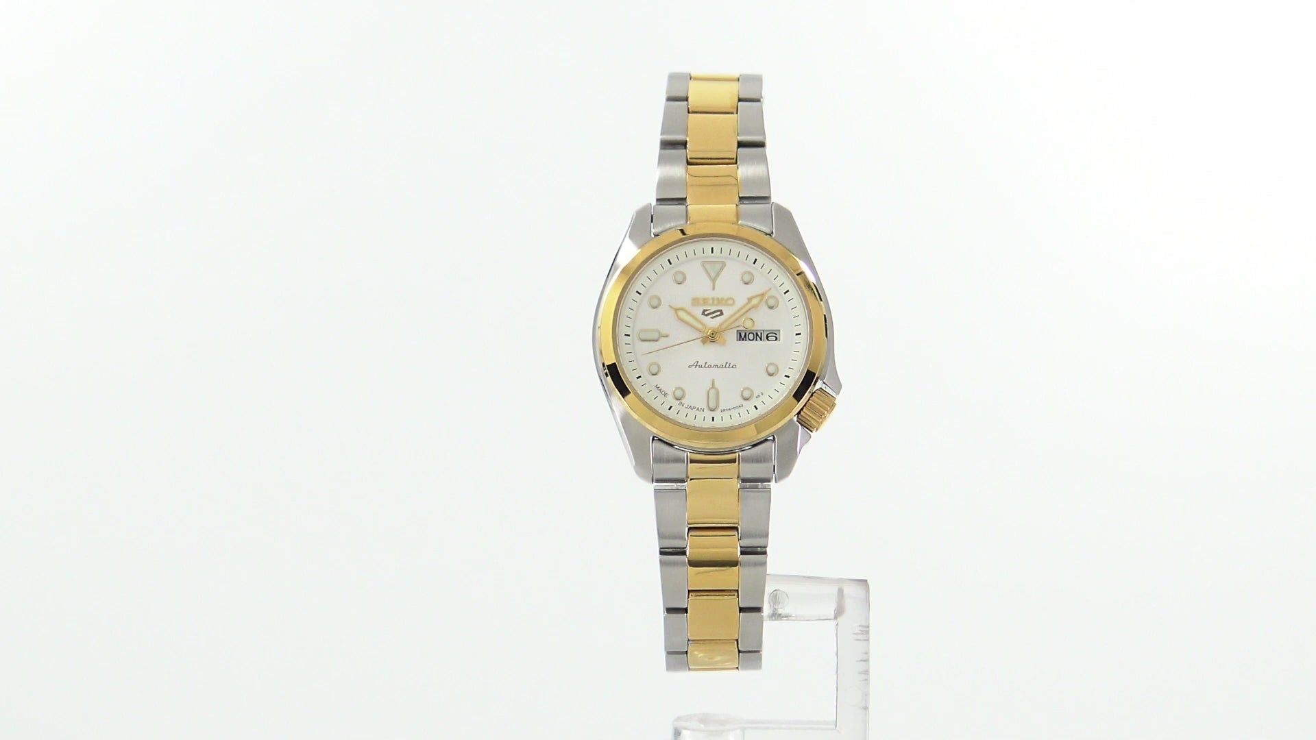 Seiko 5 Sports SRE004 automatic watch with white sunray dial, luminous hands and markers, two-tone stainless steel case and bracelet, and compact vintage-inspired design.