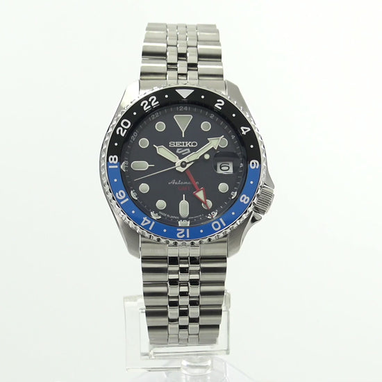 Seiko 5 Sports SSK003 automatic GMT watch with a blue dial, blue and black 24-hour GMT bezel, luminous hands and markers, stainless steel case and bracelet, and SKX sports-style design.