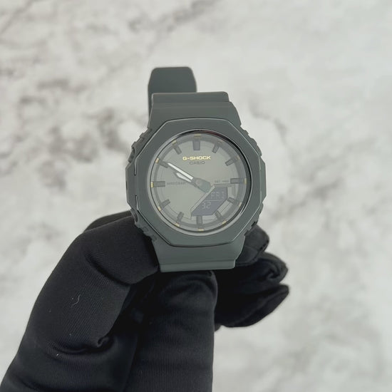 G-SHOCK GMAP2126W-8A International Women’s Day 2026 limited edition watch with metallic gray bezel, gold accents, monochrome dial, and bio-based resin band