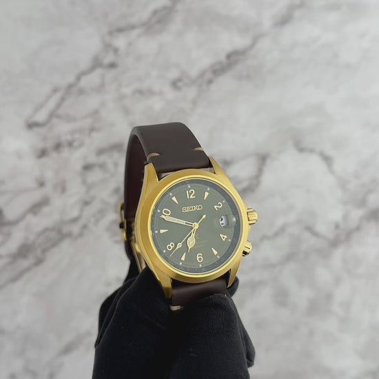SEIKO PROSPEX SPB210 Alpinist – vintage-inspired green dial with gold accents, inner compass bezel, gold-tone stainless steel case, brown leather strap, automatic movement, and 200m water resistance