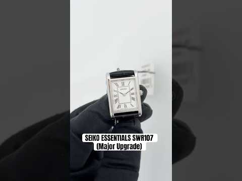 Seiko SWR107 women’s rectangular quartz watch with white Roman numeral dial, slim stainless steel case, sapphire crystal, and black leather strap.